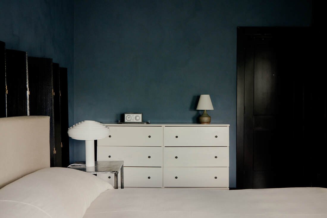 Quiet corner exposure with layered materials at Jersey Shore boutique hotel.