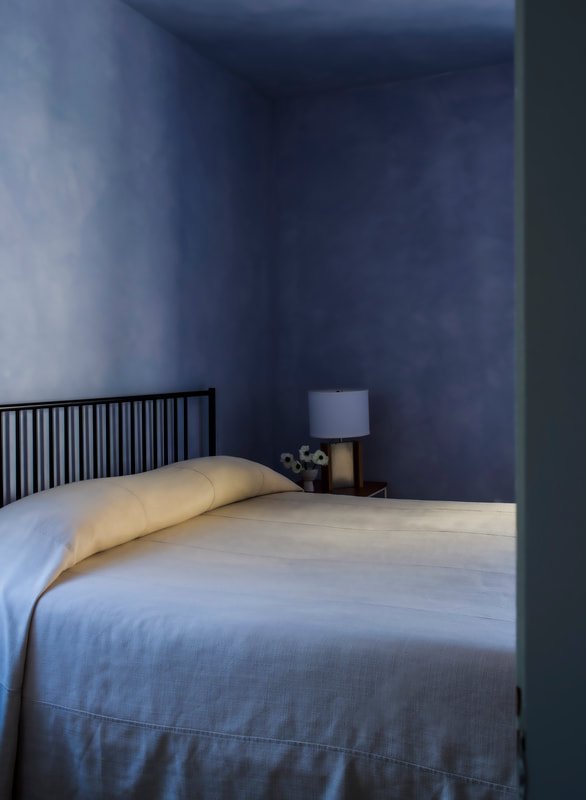 Spacious King Room with layered textures and natural light.